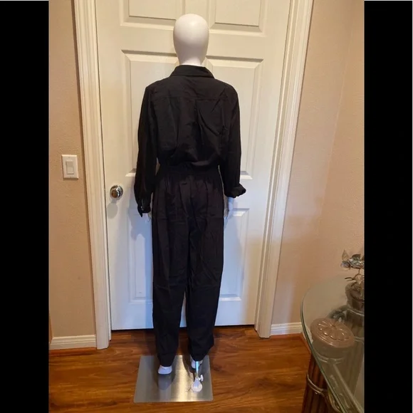 Black cotton utility button down jumpsuit.